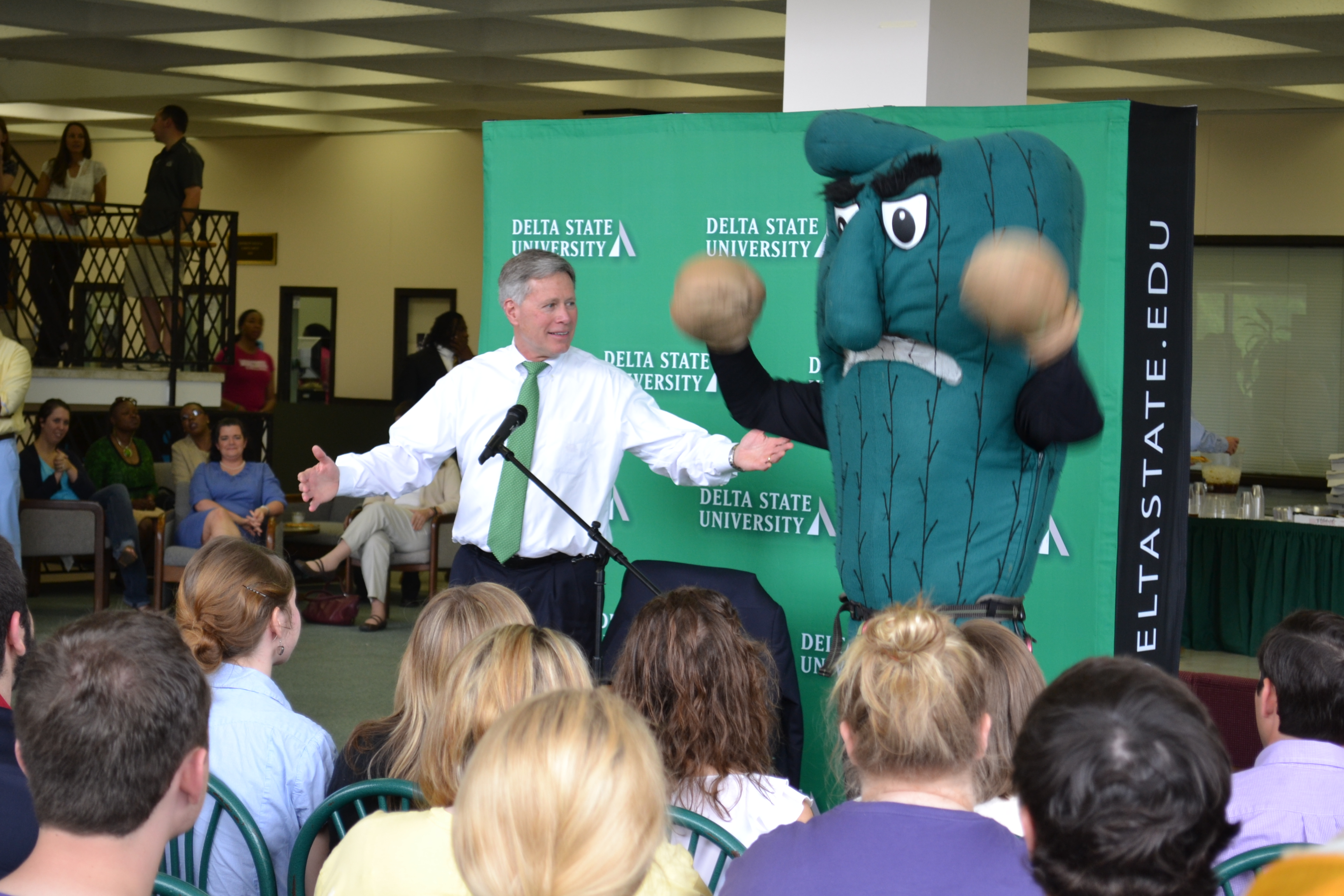 Delta State President William N. LaForge and the Fighting Okra are all “smiles” as the flash mob concludes.